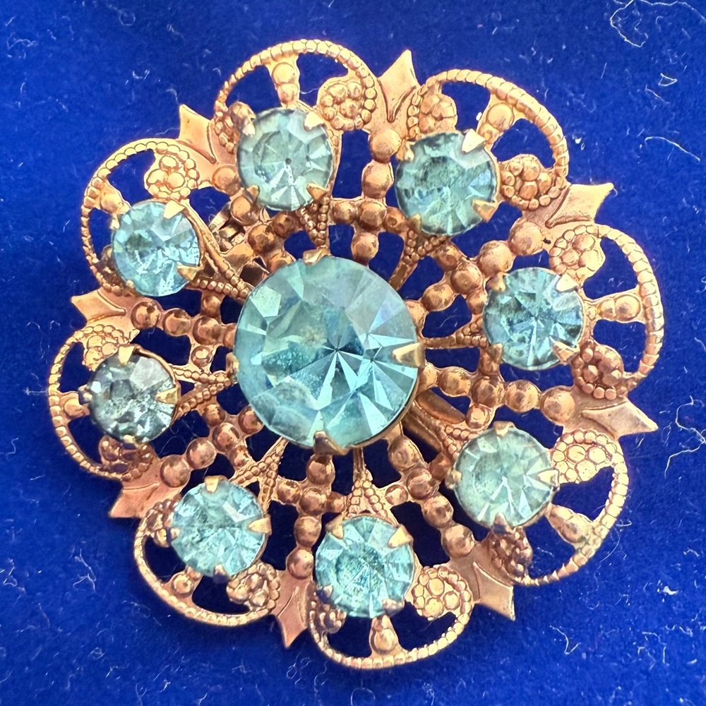 Vintage brooch light blue rhinestone gold tone pin